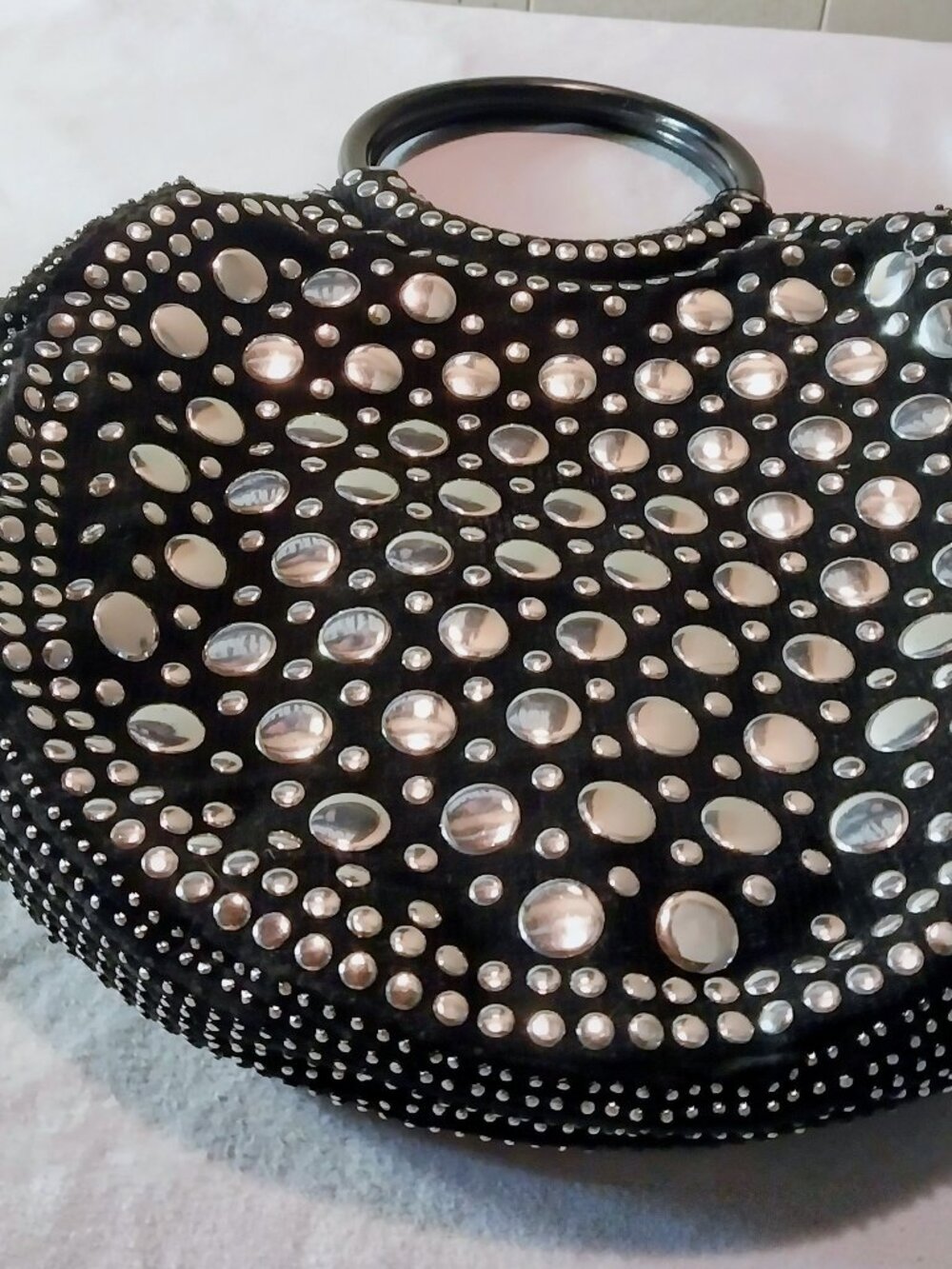 Mid century round flat handbag with big silver metal sequins.